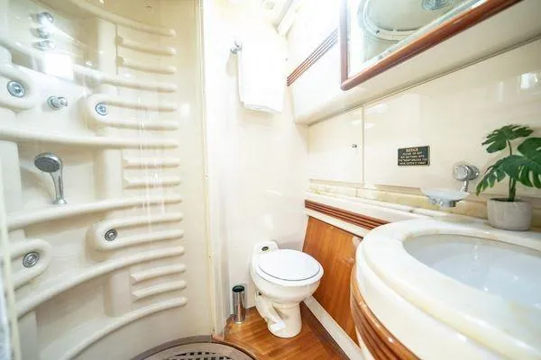 The Cure Yacht Photos Pics Luxurious bathroom in 2003 Azimut 80 Carat yacht with modern fixtures and elegant design.