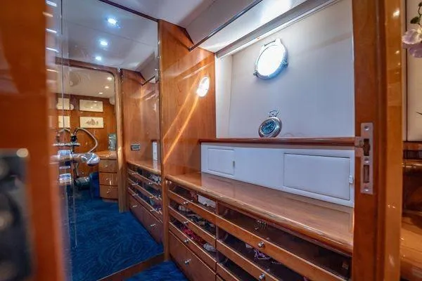 The Cure Yacht Photos Pics Luxurious interior of 2003 Azimut 80 Carat yacht with elegant wood cabinetry and nautical decor.