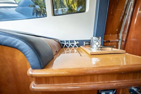The Cure Yacht Photos Pics Luxurious interior of 2003 Azimut 80 Carat yacht with polished wood and elegant decor.