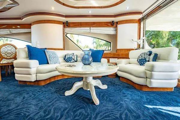The Cure Yacht Photos Pics Luxurious interior of 2003 Azimut 80 Carat yacht with elegant seating and decor.