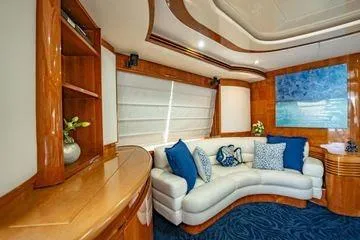 The Cure Yacht Photos Pics Luxurious interior of 2003 Azimut 80 Carat yacht with elegant seating and decor.