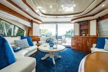 The Cure Yacht Photos Pics Luxurious interior of 2003 Azimut 80 Carat yacht with elegant seating and decor.