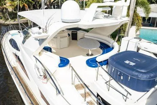 The Cure Yacht Photos Pics Luxurious 2003 Azimut 80 Carat yacht with spacious deck and elegant seating area.