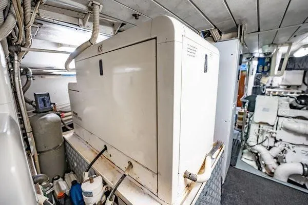 The Cure Yacht Photos Pics Engine room of 2003 Azimut 80 Carat yacht, featuring machinery and equipment.