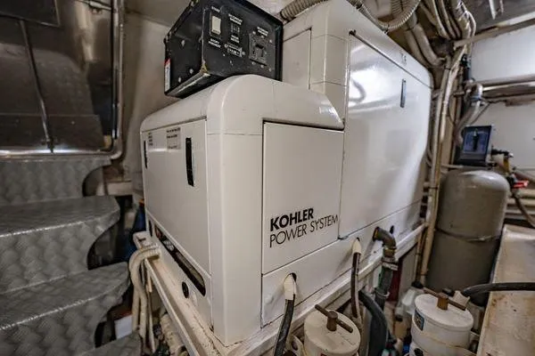 The Cure Yacht Photos Pics Engine room of 2003 Azimut 80 Carat yacht featuring Kohler power system.