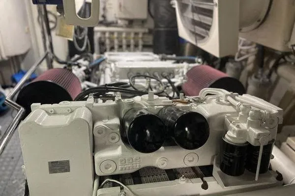 The Cure Yacht Photos Pics Engine room of 2003 Azimut 80 Carat yacht with visible components and filters.