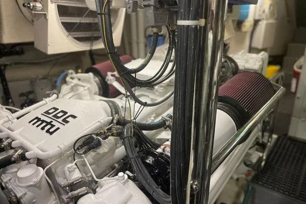 The Cure Yacht Photos Pics Engine room of 2003 Azimut 80 Carat yacht featuring MTU engines.