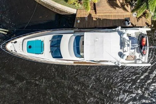 The Cure Yacht Photos Pics Overhead view of 2003 Azimut 80 Carat yacht docked by wooden pier.