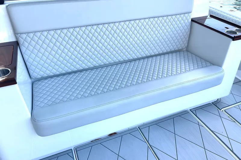  Yacht Photos Pics Luxurious quilted seating on 2024 HCB 48 Campeon boat, featuring elegant design and comfort.