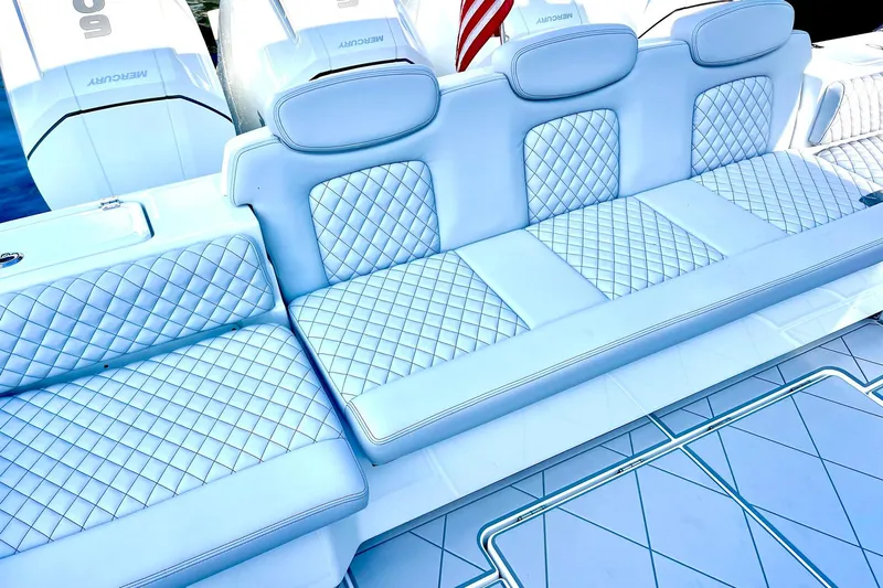  Yacht Photos Pics Luxurious seating on 2024 HCB 48 Campeon boat with quilted upholstery and sleek design.