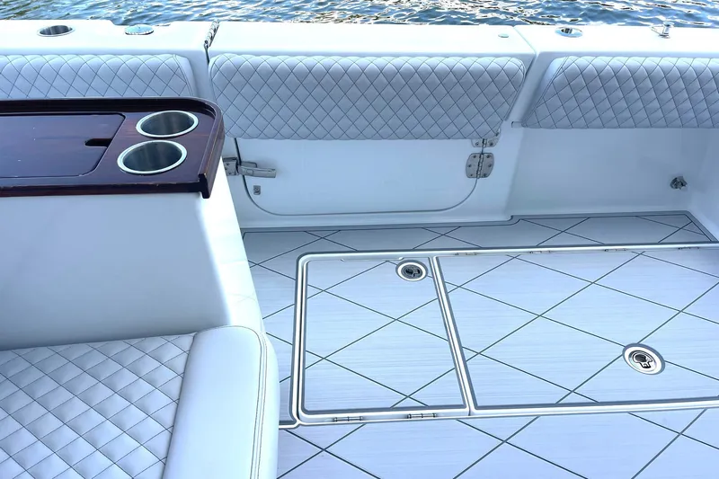  Yacht Photos Pics Luxurious interior of 2024 HCB 48 Campeon boat with quilted seating and cup holders.