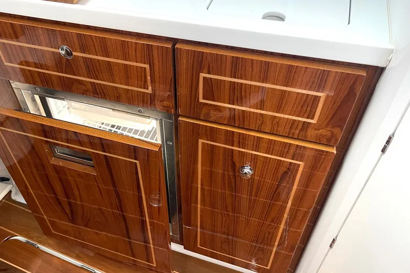  Yacht Photos Pics Luxurious wood cabinetry in 2024 HCB 48 Campeon boat interior.