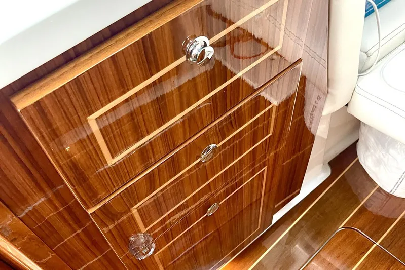  Yacht Photos Pics Luxurious wooden cabinetry inside 2024 HCB 48 Campeon boat, featuring polished finish and elegant design.