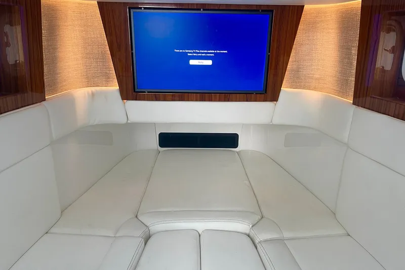  Yacht Photos Pics Luxurious interior of 2024 HCB 48 Campeon yacht with plush seating and a large screen.