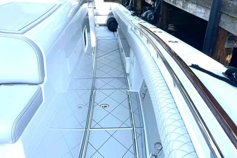  Yacht Photos Pics 2024 HCB 48 Campeon boat interior with sleek white seating and polished flooring.