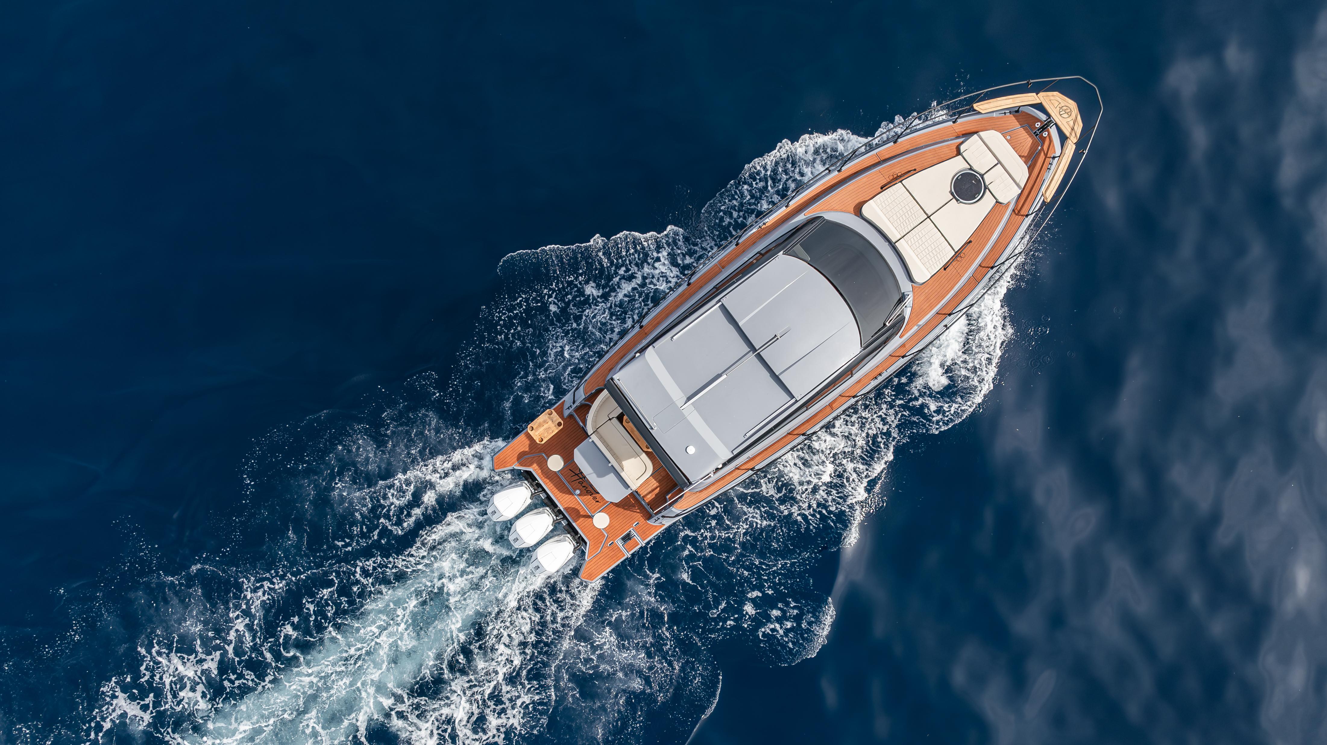 Aerial view of 2025 Hanover 415 yacht cruising on open water.