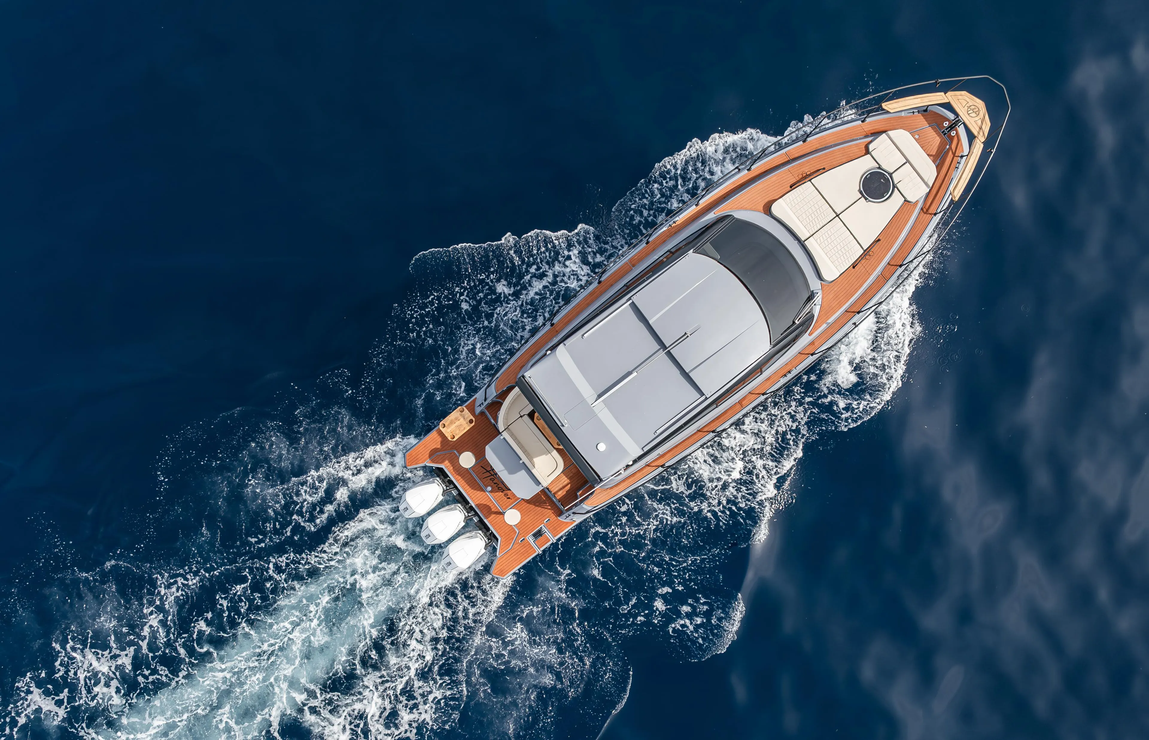 Aerial view of 2025 Hanover 415 yacht cruising on open water.