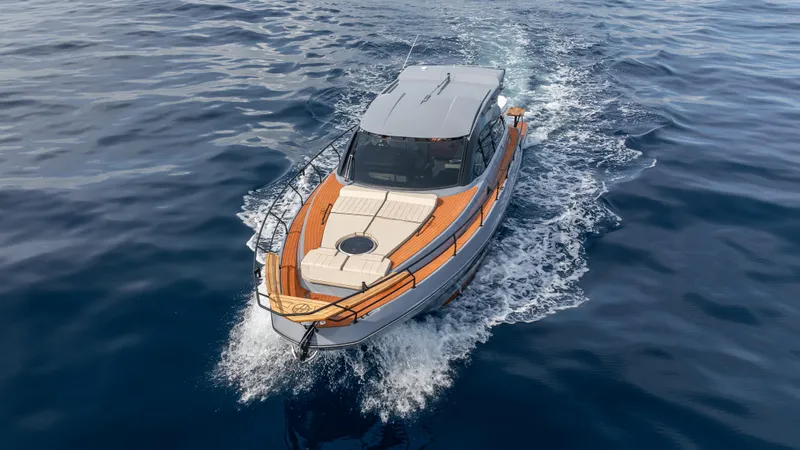  Yacht Photos Pics 2025 Hanover 415 boat cruising on open water, top view.