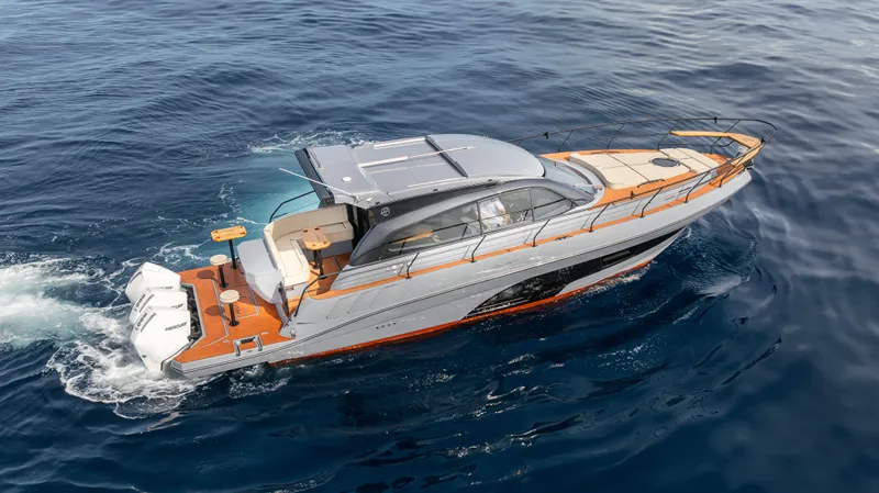  Yacht Photos Pics 2025 Hanover 415 yacht cruising on open water, showcasing sleek design and luxury features.