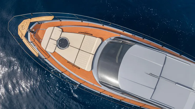  Yacht Photos Pics Aerial view of 2025 Hanover 415 yacht with sleek deck design on blue ocean.