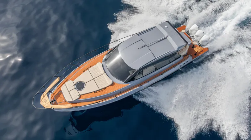  Yacht Photos Pics 2025 Hanover 415 yacht cruising on open water, top view.