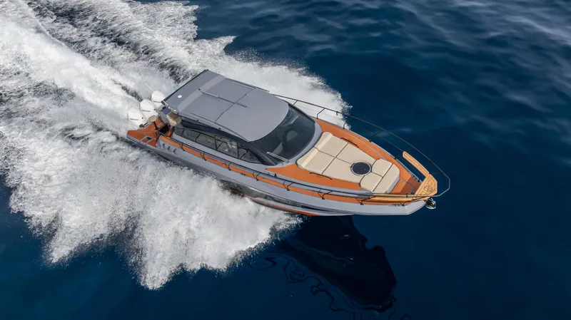  Yacht Photos Pics 2025 Hanover 415 yacht cruising on open water, top view.