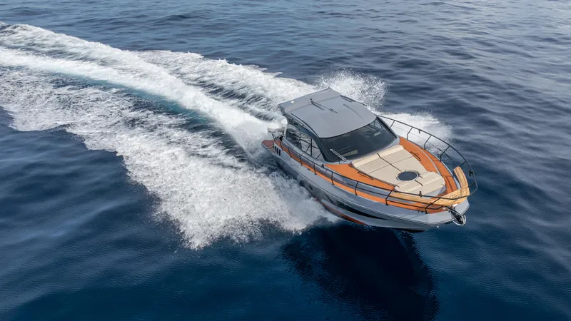  Yacht Photos Pics 2025 Hanover 415 boat cruising on open water, aerial view.