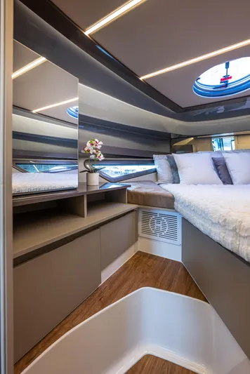  Yacht Photos Pics Luxurious interior of 2025 Hanover 415 yacht with modern design and cozy bedding.