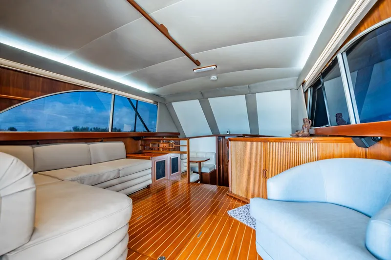 Denise Catherine Yacht Photos Pics Luxurious interior of 1991 Jersey 42 Convertible Sportfisherman with elegant seating and wood finishes.