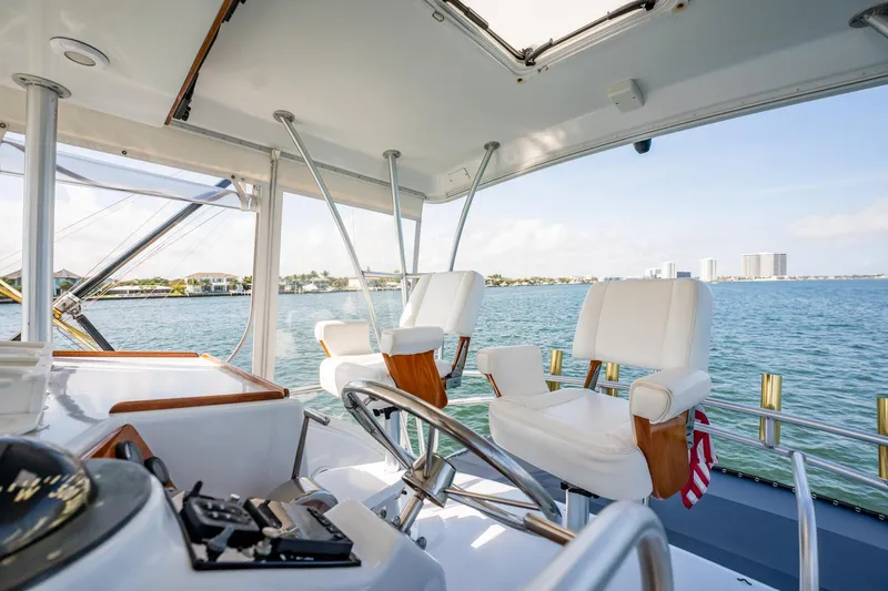 Denise Catherine Yacht Photos Pics Interior view of 1991 Jersey 42 Convertible Sportfisherman yacht with ocean backdrop.