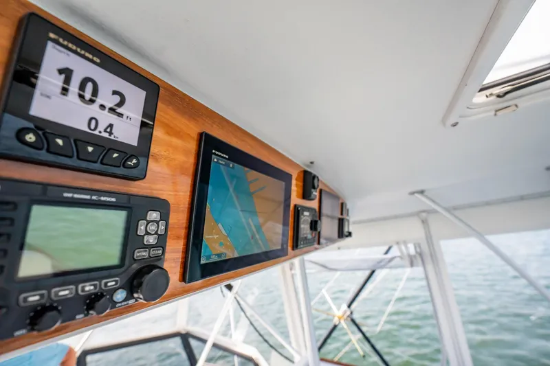 Denise Catherine Yacht Photos Pics Control panel of a 1991 Jersey 42 Convertible Sportfisherman boat with navigation displays.