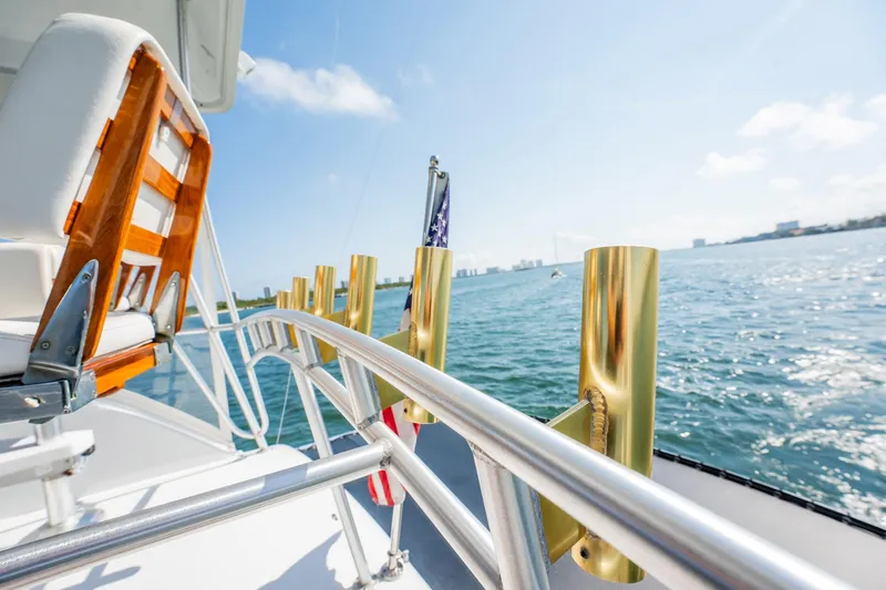 Denise Catherine Yacht Photos Pics 1991 Jersey 42 Convertible Sportfisherman yacht deck with ocean view and clear sky.