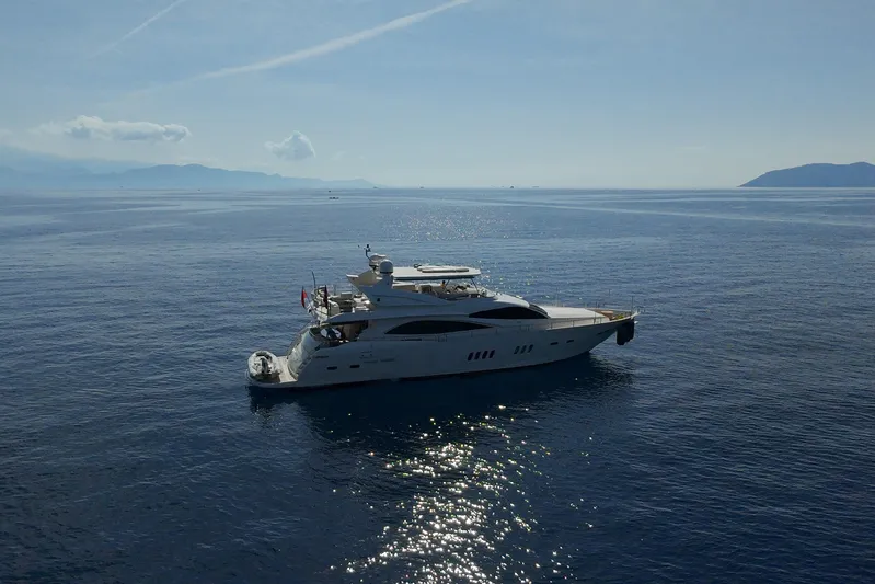 Swordfish 68 Yacht Photos Pics Sunseeker 90 Yacht 2009 cruising on calm blue sea under clear sky.