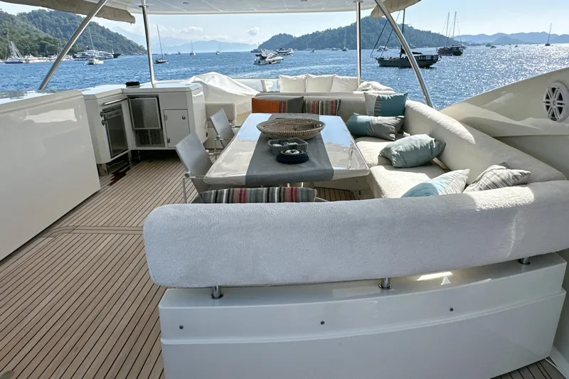 Swordfish 68 Yacht Photos Pics Luxurious Sunseeker 90 Yacht 2009 with elegant outdoor seating and scenic ocean view.