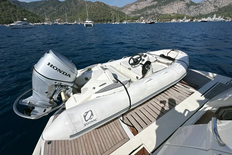 Swordfish 68 Yacht Photos Pics Inflatable Zodiac boat with Honda motor on Sunseeker 90 Yacht, 2009, in scenic bay.