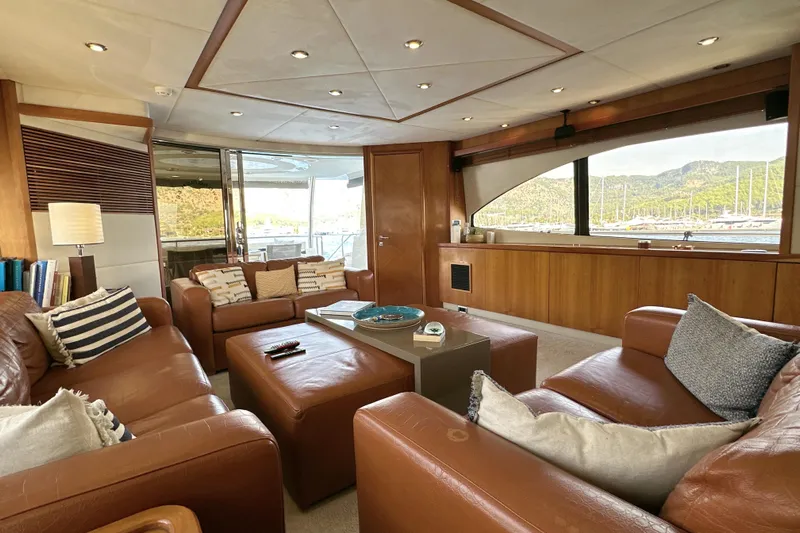 Swordfish 68 Yacht Photos Pics Luxurious interior of 2009 Sunseeker 90 Yacht with leather seating and scenic window view.