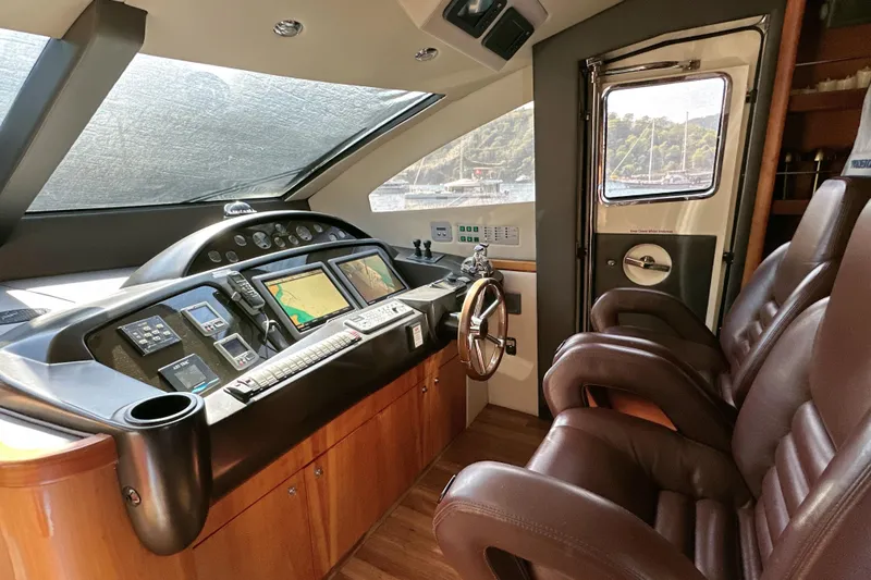 Swordfish 68 Yacht Photos Pics Luxurious helm of 2009 Sunseeker 90 Yacht with advanced navigation controls.