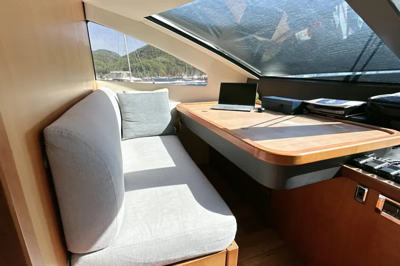 Swordfish 68 Yacht Photos Pics Interior of 2009 Sunseeker 90 Yacht with cozy seating and workspace.