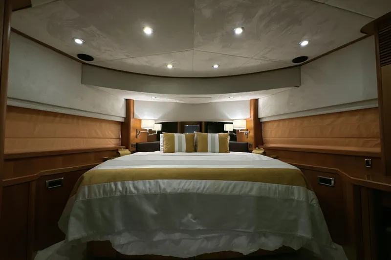 Swordfish 68 Yacht Photos Pics Luxurious bedroom interior of 2009 Sunseeker 90 Yacht with elegant lighting and decor.