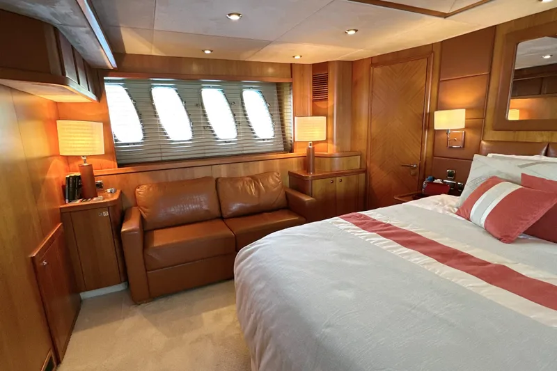 Swordfish 68 Yacht Photos Pics Luxurious 2009 Sunseeker 90 Yacht bedroom with elegant wood paneling and cozy furnishings.