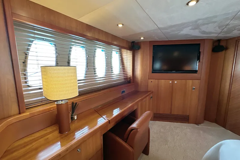 Swordfish 68 Yacht Photos Pics Luxurious interior of 2009 Sunseeker 90 Yacht with wooden furnishings and a flat-screen TV.