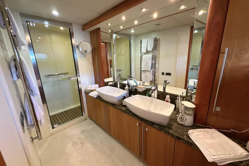 Swordfish 68 Yacht Photos Pics Luxurious bathroom in 2009 Sunseeker 90 Yacht with dual sinks and glass shower.