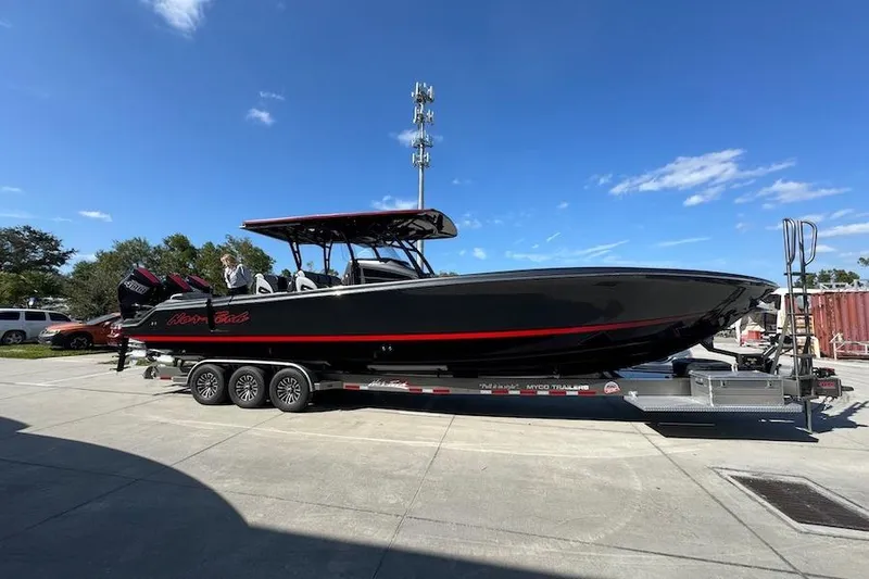  Yacht Photos Pics 2025 Nor-Tech 390 Sport Center Console boat on trailer, sleek black design with red accents.