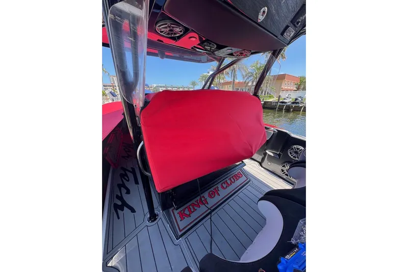 Yacht Photos Pics 2025 Nor-Tech 390 Sport Center Console interior with red cover and "King of Clubs" mat.