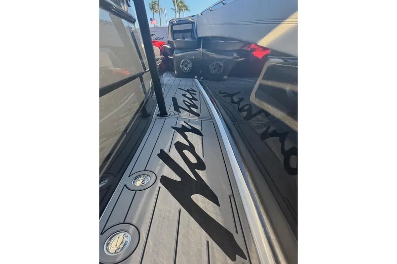  Yacht Photos Pics 2025 Nor-Tech 390 Sport Center Console deck with logo, sleek design, and modern features.