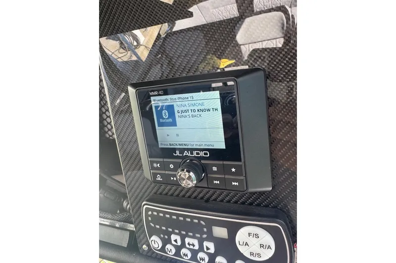  Yacht Photos Pics JL Audio system on 2025 Nor-Tech 390 Sport Center Console, displaying music track.