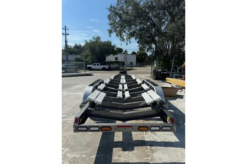  Yacht Photos Pics Trailer for 2025 Nor-Tech 390 Sport Center Console, parked outdoors.