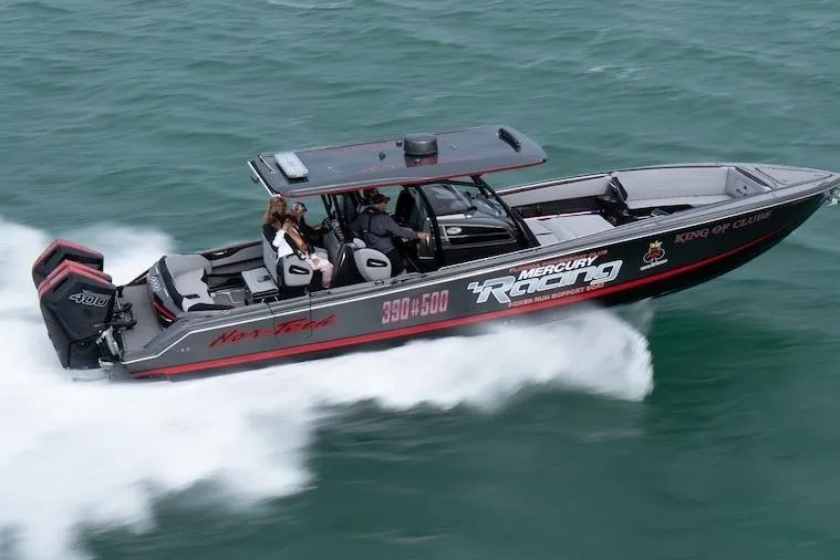  Yacht Photos Pics 2025 Nor-Tech 390 Sport Center Console boat speeding on water, featuring Mercury Racing engines.