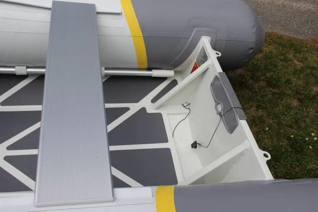 2022 ZAR Mini Rib HDL10 inflatable boat interior with seating and storage.