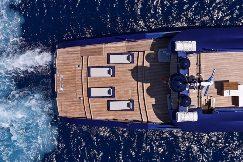  Yacht Photos Pics Aerial view of 2009 MMGI 44m yacht cruising on blue ocean waters.